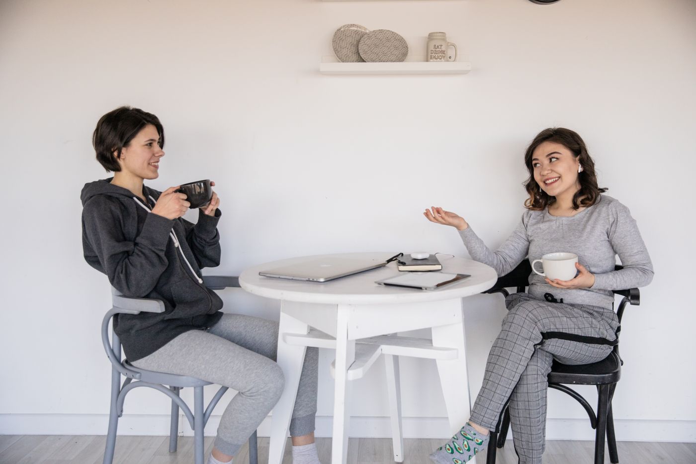 Two people chatting warmly over a cup of coffee
