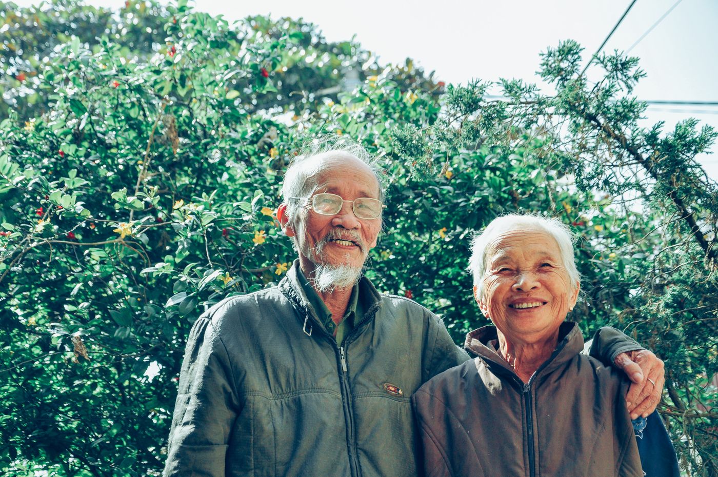 An older couple relaxing outdoors, enjoying a comfortable retirement