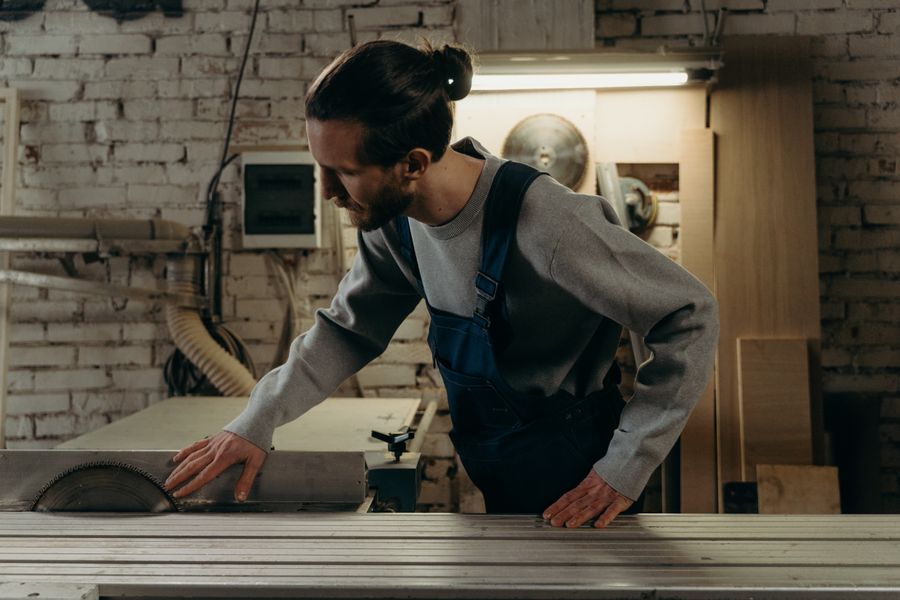 A tradesperson at work in a woodworking workshop